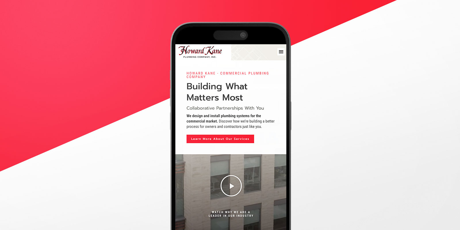 A mobile phone displaying Howard Kane Plumbing's website with the headline "Building What Matters Most" on a red and white background, showcasing their robust online presence.