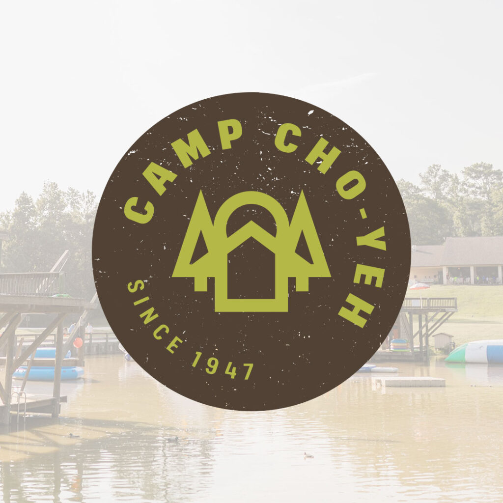 The Camp Cho-Yeh logo, featuring a circular design with trees and a cabin, proudly displays the text "Since 1947." Set against a serene lake backdrop with inflatable water structures and a wooden dock, it captures the charm that defines Camp Cho-Yeh's beloved online presence.