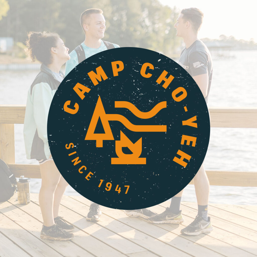 The Camp Cho-Yeh logo, featuring trees and a campfire, overlays a photo of three people chatting on a dock by the water. Text reads "Since 1947," capturing over seven decades of tradition and community spirit. Enhance your online presence by exploring unforgettable experiences at Camp Cho-Yeh.